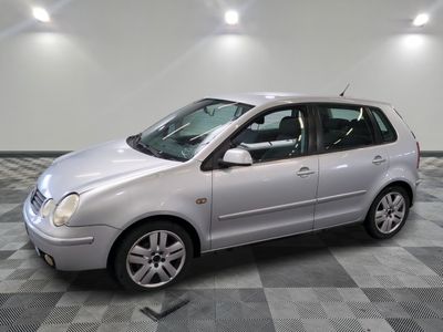 a picture of a silver car parked in a garage