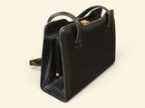 black leather handbag on white background with clipping for the handle