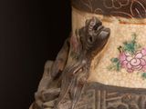 a large vase with a design on it on a table