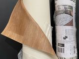 a roll of paper and a roll of tape on a shelf