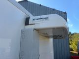 a white air conditioner on the side of a building