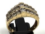 an image of a gold and diamond ring on a black stand