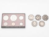 a close up of a box of coins and a coin set