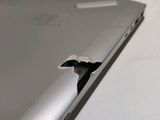 a small crack in the back of a laptop computer