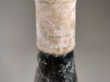 a bottle of wine that is sitting on a table