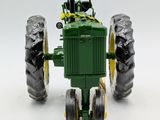 a toy tractor that is sitting on a white surface