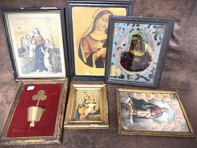 four framed pictures of the virgin of guadalupe and other religious items