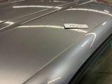 a sticker on the hood of a car that is parked in a garage