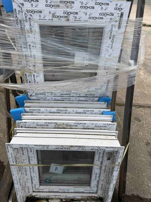 a stack of windows that have been wrapped in plastic