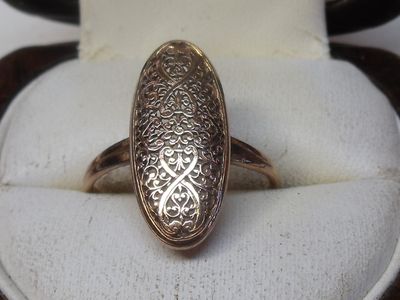 an image of a ring in a box on a table