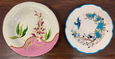 two plates that are sitting on a wooden table