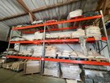 a lot of shelves that have bags on them
