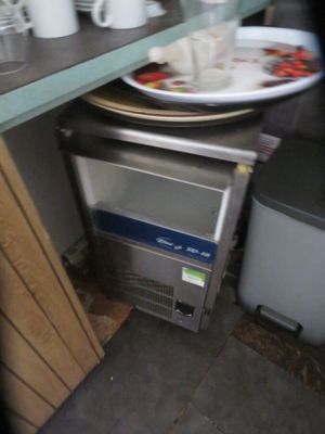 a plate of food sitting on a counter next to a toaster oven