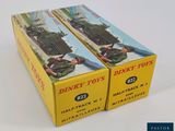two boxed boxes of boxed toys sitting on top of a white surface