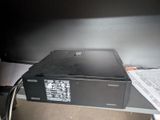 a black box sitting on top of a desk next to a computer