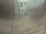 a close up of a metal helmet with numbers on it