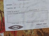 a label on the back of a blanket that says tapisserie de laine