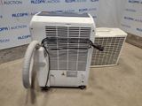 a small air conditioner sitting on the floor next to a small air conditioner
