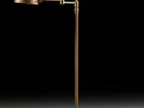 an antique brass floor lamp with a black background