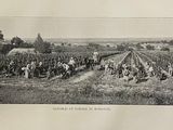 a black and white photo of a group of people in a field