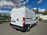 a white van that is parked in a parking lot