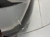 a close up of a person standing next to a car