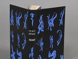an open box with blue silhouettes on it sitting on a gray surface