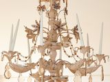 a chandelier that has a bunch of candles hanging from it