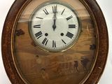 a clock with roman numerals on the face of it