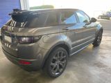an image of a grey range rover parked in a garage