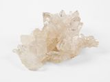 a close up of a cluster of white crystals on a white surface