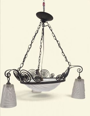an image of a chandelier hanging from a ceiling with two lamps