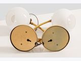 pair of vintage brass plated glasses with white glass shades
