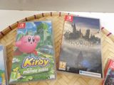 a lot of video games on a tray on a table