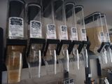a shelf with a bunch of bottles and containers on it