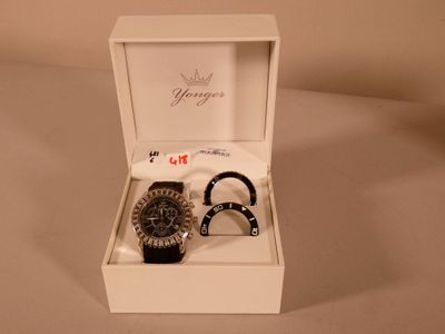 a watch and bracelet in a white box on a table