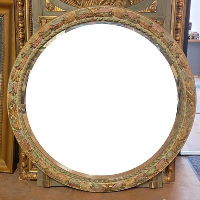 a mirror that is sitting on a table in front of a mirror