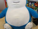 a blue and white pokemon stuffed animal sitting on a table