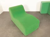 a green chair and a green table in a room