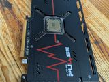 a close up of a video card sitting on top of a wooden table