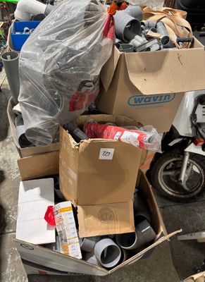 a pile of boxes that are sitting on the street
