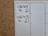 a piece of paper that has a bunch of stickers on it