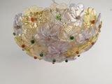 an image of a glass chandelier hanging from a ceiling