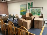 many boxes on the table and chairs in the room