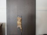 a refrigerator that has a piece of paper stuck to it