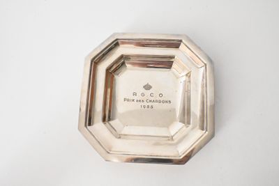 an image of a silver plate on a white surface