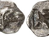 a close up of a coin with a bear on it