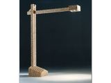 a tall lamp with a metal structure on a black background