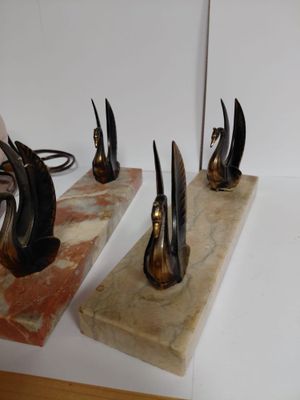three pieces of art that are sitting on a table