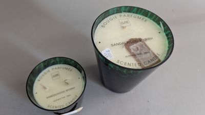 candles are sitting next to each other on a table